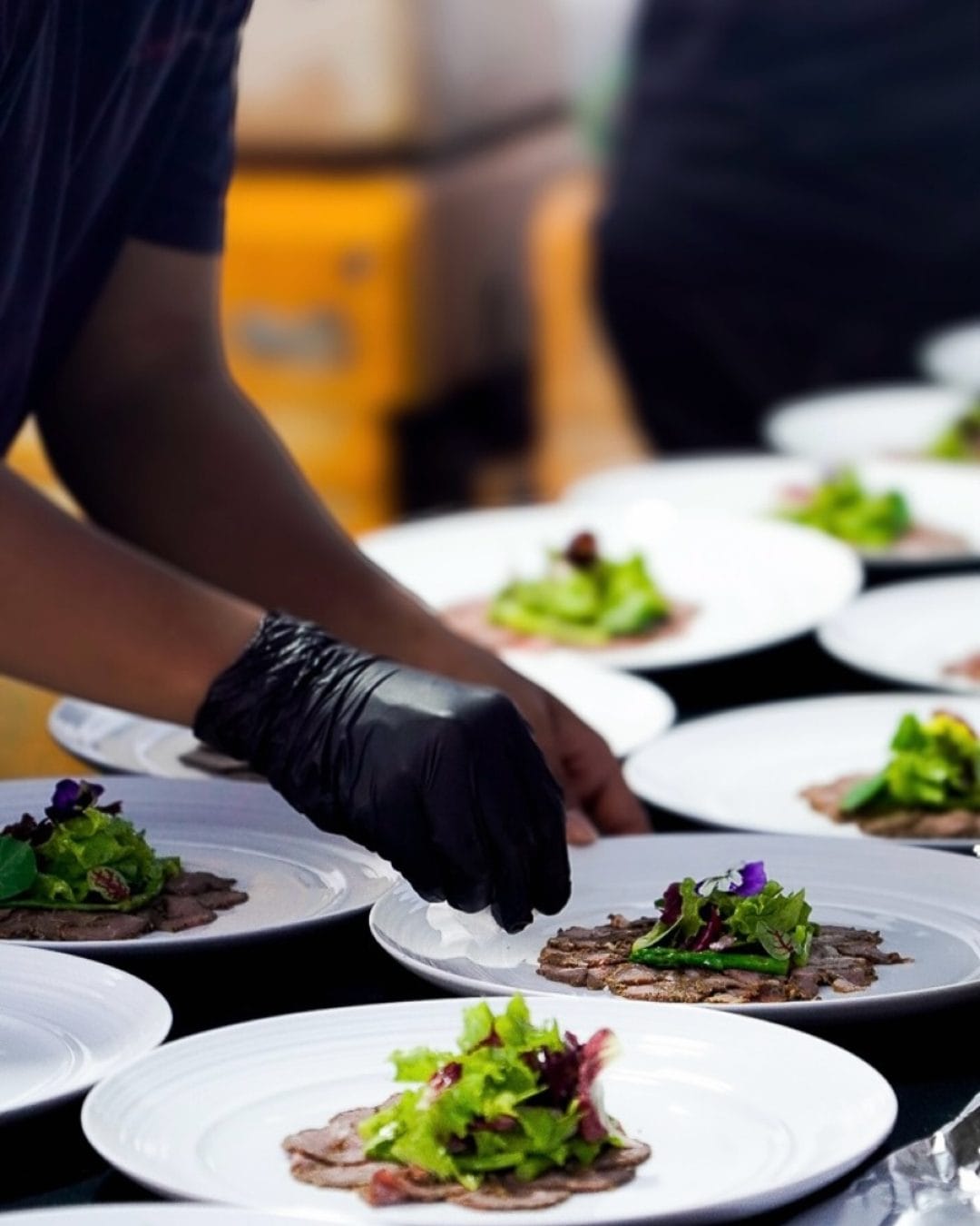 A caterer serving plates in Bali