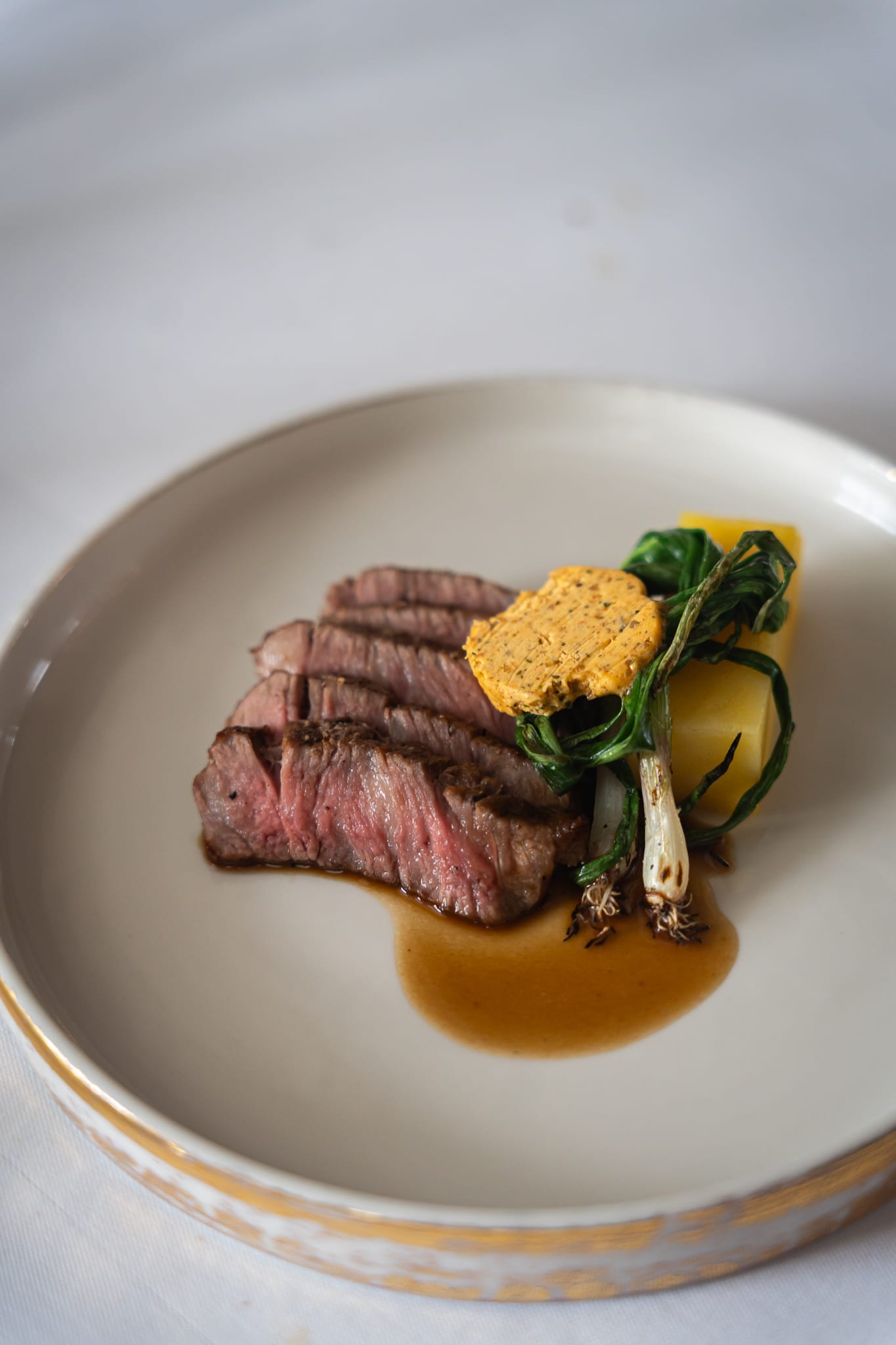 A villa catering Bali dish of filet mignon steak with potato gratin and vegetables